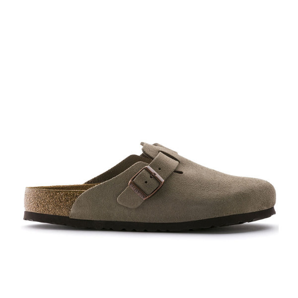 A side view of the BIRKENSTOCK Mens Boston Soft Footbed Taupe clog sandal in velvety suede features a Wide strap with a metal buckle, cushioned cork footbed, and a black rubber sole.