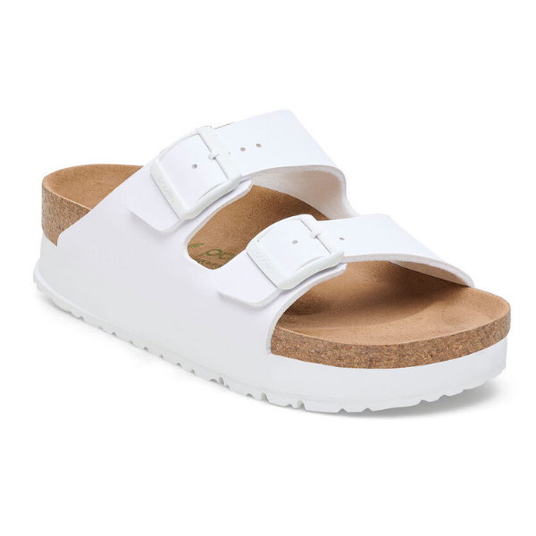 The Birkenstock Womens Arizona Flex Platform White sandal features two adjustable buckle straps, a cork footbed, and a white sole by BIRKENSTOCK, shown at an angle on a white background.