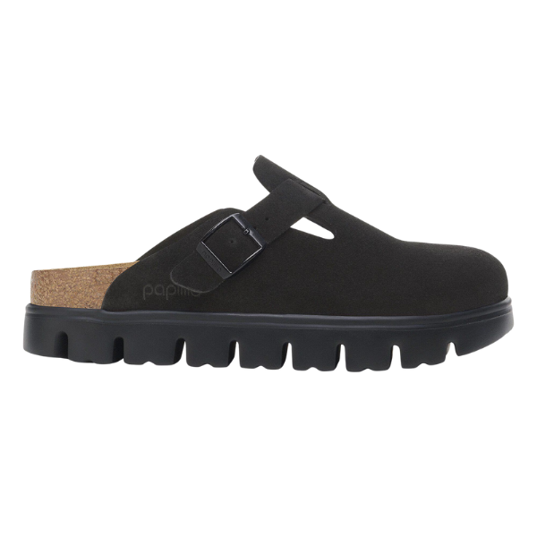 The BIRKENSTOCK Women's Boston Chunky Black is a black suede platform clog with a rugged sole, contoured cork footbed, and an adjustable buckle strap.