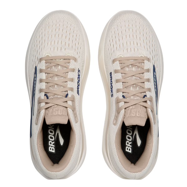 A pair of BROOKS Men's Ghost Max 3 Coconut running shoes in beige, shown from above, featuring breathable mesh uppers, cushioned support, and navy blue Brooks logos on the sides and insoles.