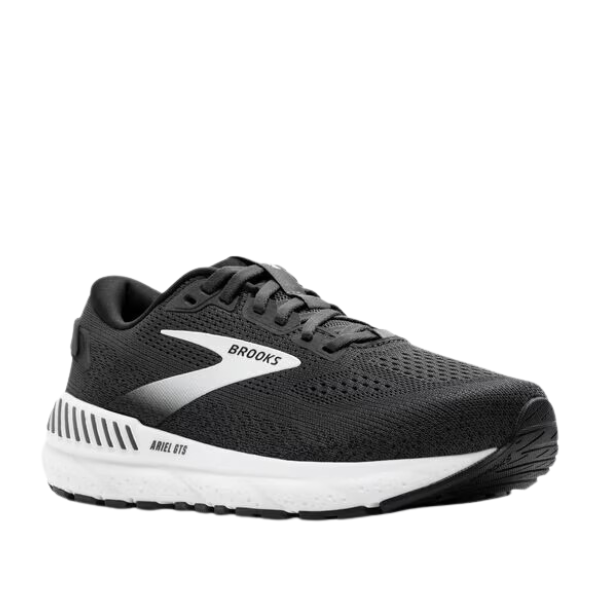 The BROOKS Womens Ariel GTS 24 Wide Black/White running shoe features a mesh upper, white midsole, black outsole, and GuideRails support system, shown against a white background.