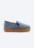Side view of washed denim espadrille flat with side gore detail and a natural braided jute platform sole, handcrafted in Spain