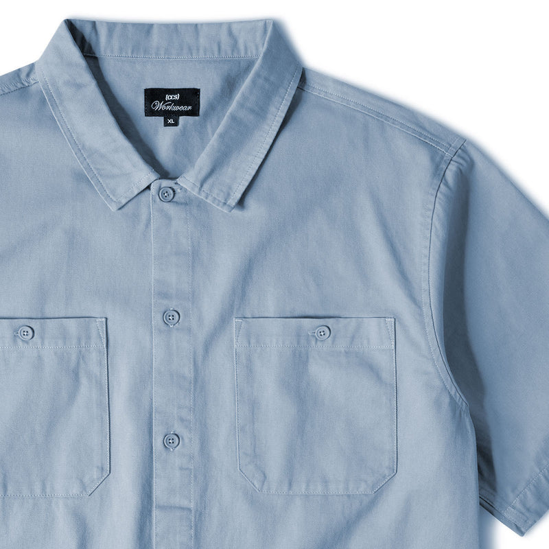 Light blue shirt CCS Work Shirt with a collar and pocket on a white background