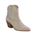 The DJANGO & JULIETT Django & Juliette Womens Wagon Silver Jewel is a Western-style ankle boot with a pointed toe and chunky angled heel, fully adorned in sparkling rhinestones for eye-catching style, set against a white background.