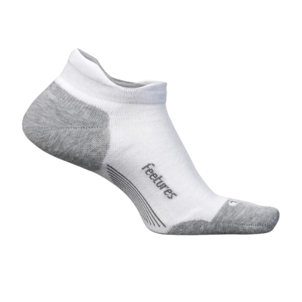 The FEETURES Unisex Elite Max Cushion No Show Tab White sock features gray heel and toe accents, targeted compression, and “feetures” printed on the side, shown on a plain white background.