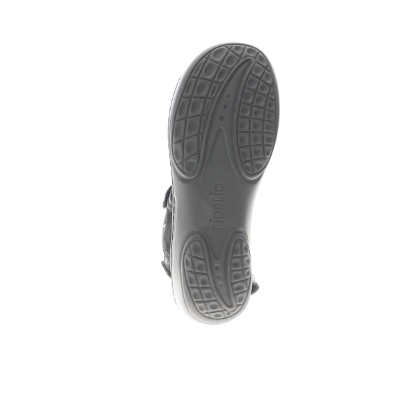 The image shows the sole of the FIDELIO Womens Liberty Black sandal, featuring textured rubber grip patterns and Fidelio embossed in the center. Designed for comfort, its ideal for those with bunions or plantar fasciitis. Photographed on a white background.