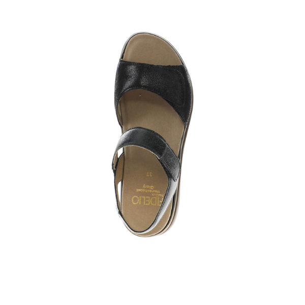 The Fidelio Womens Trinity Black sandal by FIDELIO is a black leather open-toe design with ankle and toe straps, a tan footbed, and viewed from above on a white background. A stylish and comfortable choice for women.