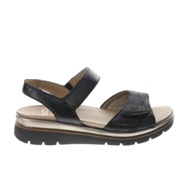 The Fidelio Womens Trinity Black by FIDELIO is a leather sandal with two adjustable straps, a cushioned beige footbed, and a textured rubber sole—ideal for women with bunions.