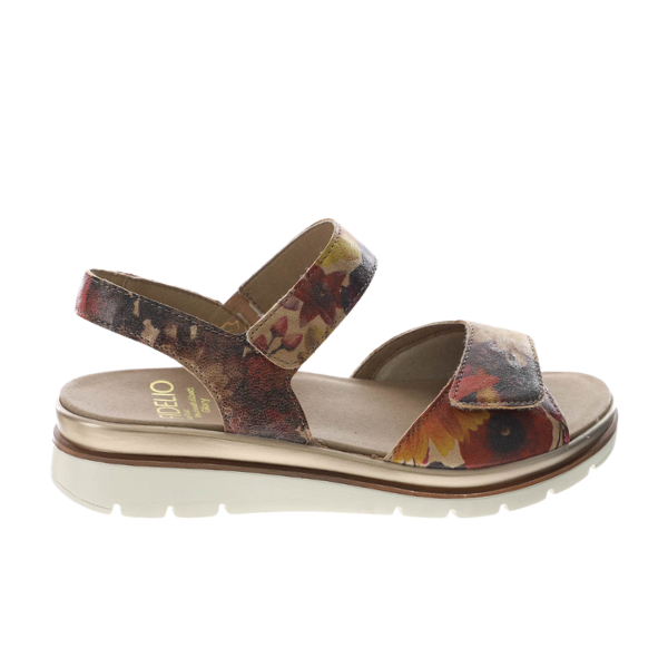 The FIDELIO Womens Trinity Multi Sandal features a floral pattern, open toe, low platform sole, cushioned footbed for pain relief, and two adjustable Velcro straps, shown in side view on a white background.