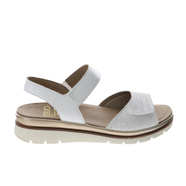 The Fidelio Womens Trinity White sandal by FIDELIO features adjustable ankle and front straps, a thick cushioned sole ideal for plantar fasciitis, a beige interior, and a brown accent stripe above the tread.