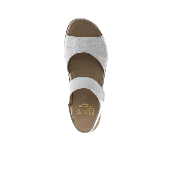 The Fidelio Womens Trinity White sandal by FIDELIO is a single white open-toe design with two Wide straps, a cushioned tan insole for plantar fasciitis comfort, and gold FIDELIO branding on the insole, viewed from above.