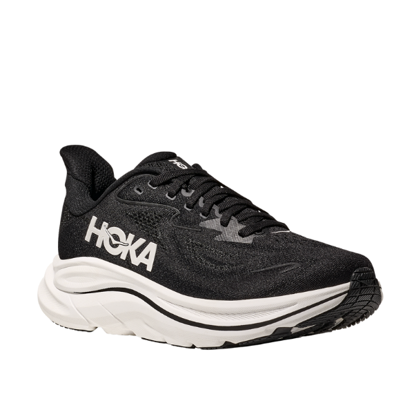 The HOKA Mens Clifton 10 Black/White features a thick white sole and bold white HOKA logo, shown against a plain white background—ideal for those seeking cushioned running shoes.