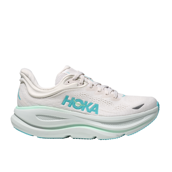 The HOKA Womens Bondi 9 White/Blue is an ultra-cushioned running shoe with a thick sole, breathable mesh upper, and signature side logo—ideal for women seeking superior comfort on their runs.