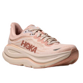 The HOKA Women's Bondi 9 Wide Rose/Latte running shoes feature a light pink mesh upper, thick cushioned sole for comfort, textured outsole for traction, lace-up closure, and HOKA branding on the side.