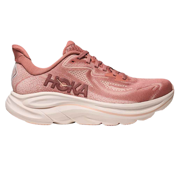 The HOKA Women's Clifton 10 Wide Blush running shoe features a thick cushioned sole, breathable mesh upper, and side HOKA logo. Shown in pink from a side profile on a white background.