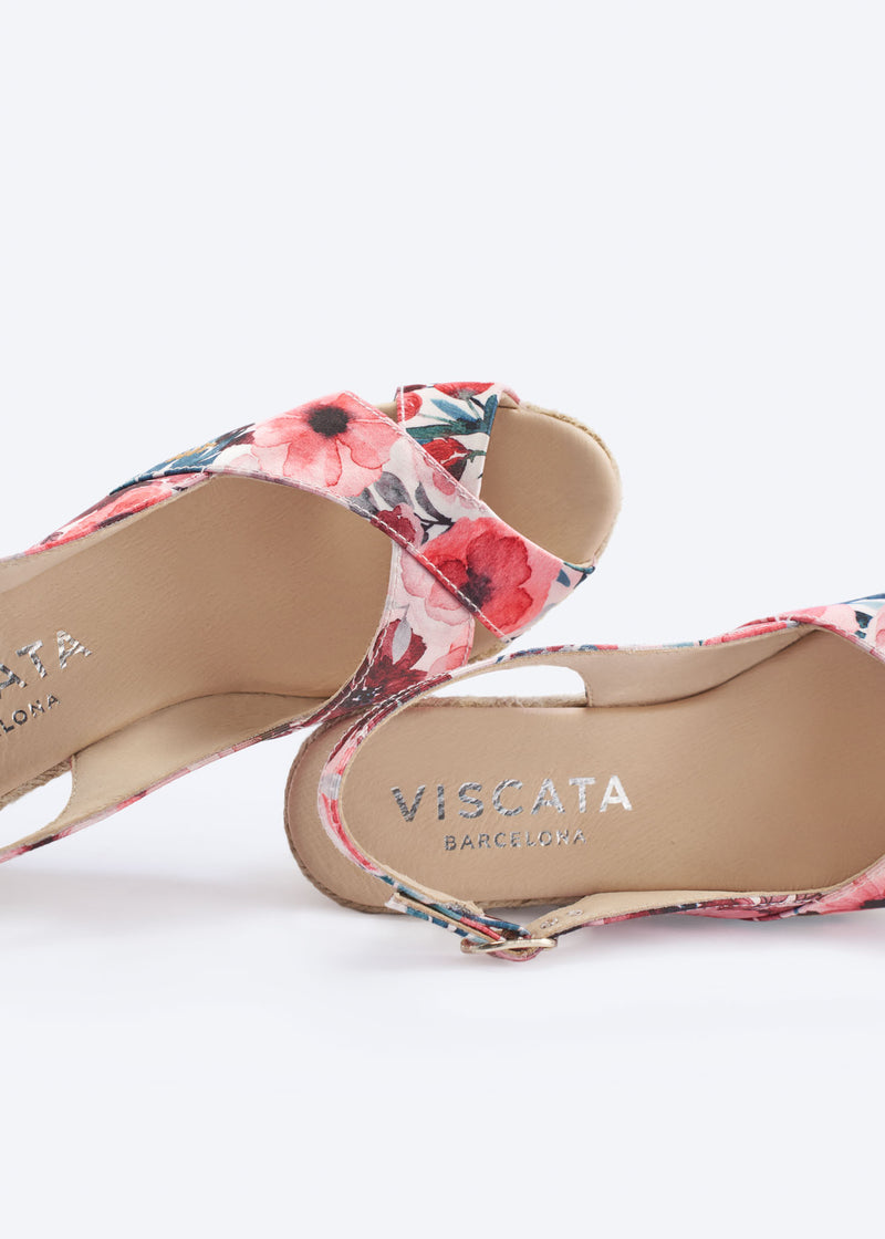 Close-up of floral print wedge espadrille sandal with crossover front straps and slingback detail, handcrafted in Spain