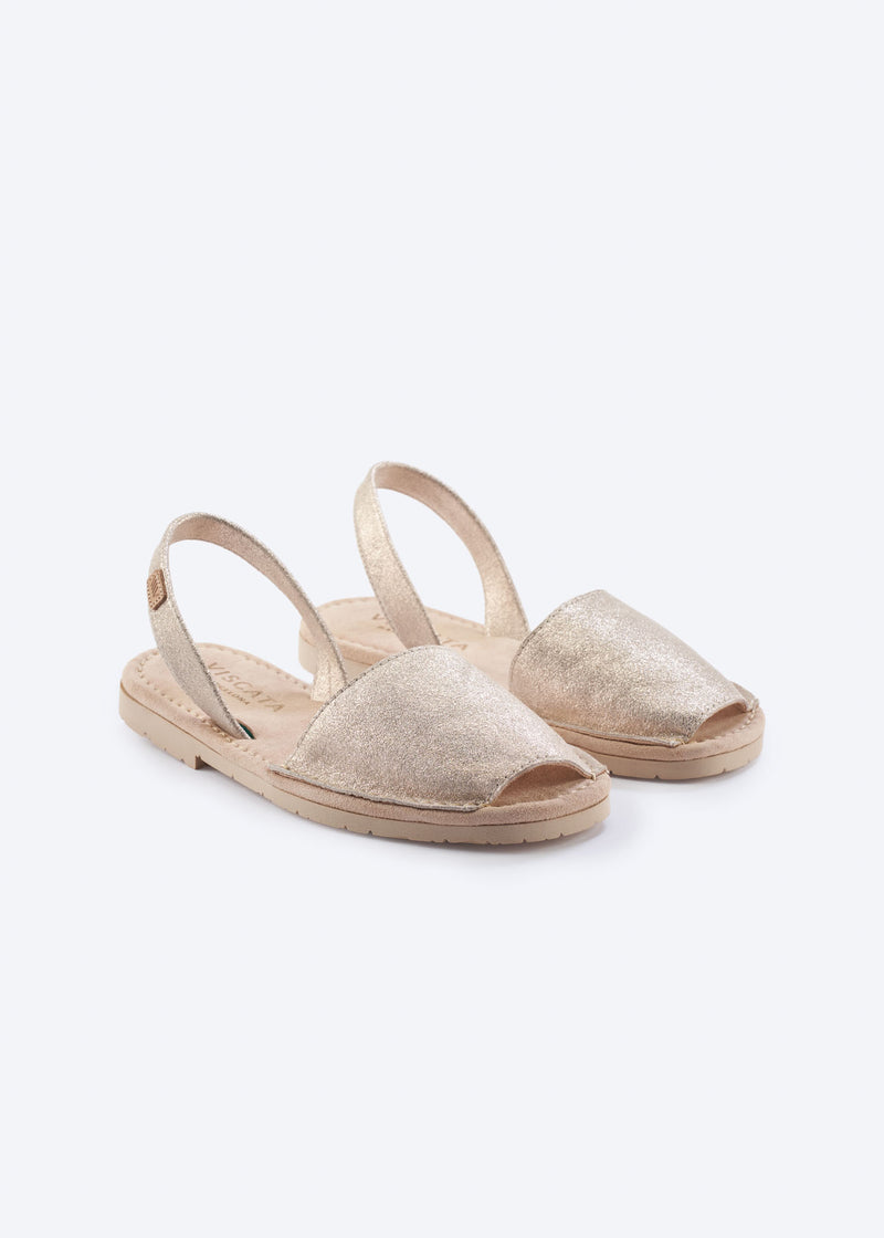 Women’s metallic gold leather espadrille sandals with slingback straps and open-toe design, shown as a pair on a clean white background.