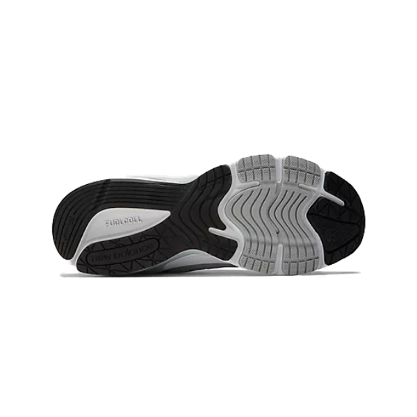 The image shows the black and gray rubber outsole of the NEW BALANCE Mens 990 v6 Wide Grey, with segmented tread patterns and textured grooves for traction.