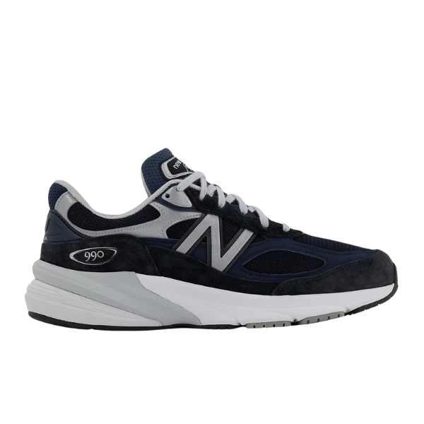 The NEW BALANCE Mens 990 V6 Wide Navy features a navy blue and gray upper, white laces, a white midsole, and a black and gray outsole, viewed from the side.