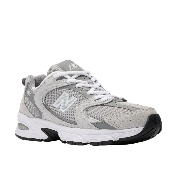 The New Balance Unisex 530 Grey features mesh and suede panels, white laces, an ABZORB midsole, and a black rubber sole. Displayed on a white background.