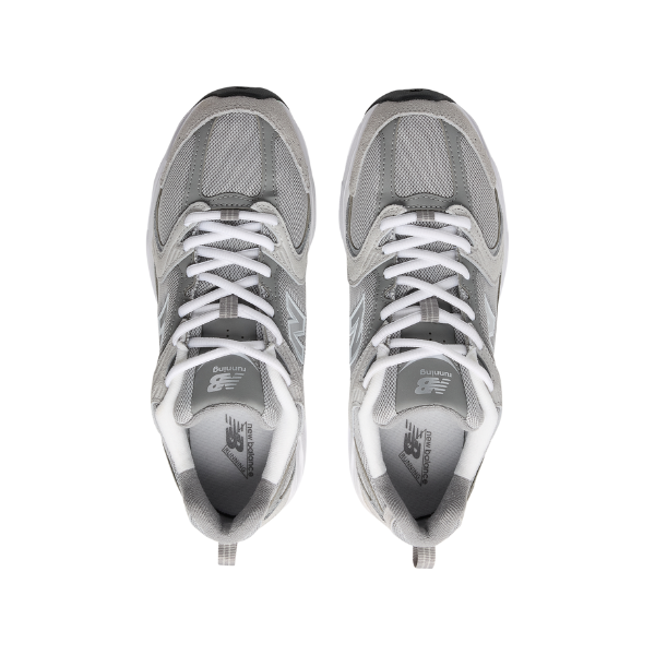 The New Balance Unisex 530 Grey running shoes by NEW BALANCE are shown from above with white laces, mesh uppers, and NB logos on the tongues, aligned side by side on a white background.