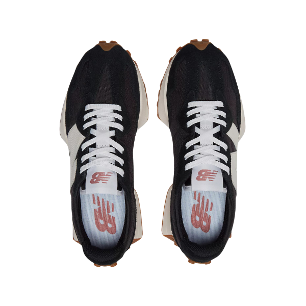 The New Balance Womens 327 Black/White running shoes feature white laces, red New Balance logo insoles, and gum brown soles, shown here from above.
