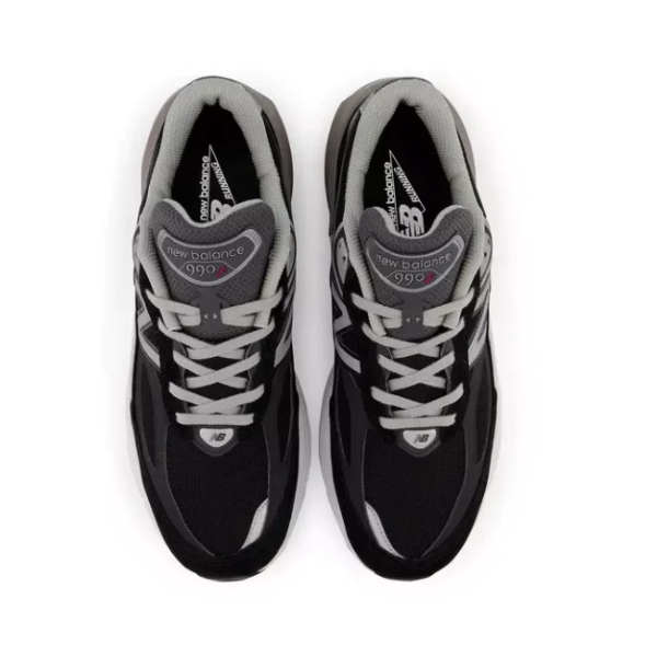 A top view of New Balance Womens 990 V6 Black running shoes with white laces and visible brand logo and model number on the tongues, set against a white background.