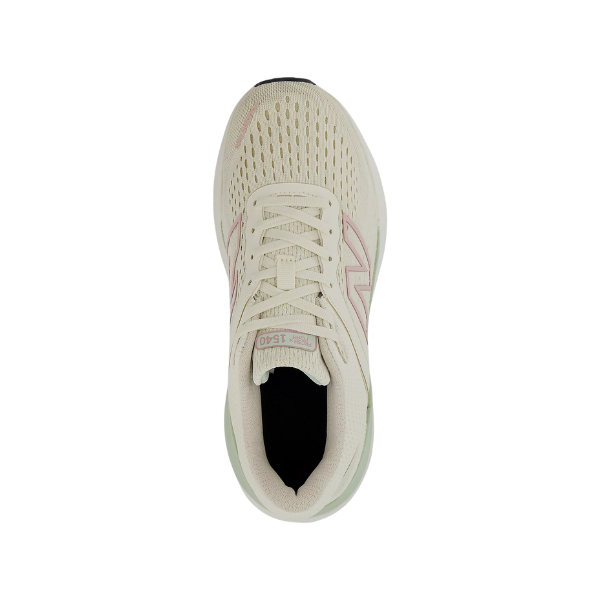 Top view of the New Balance Womens Fresh Foam X 1540v4 Wide Beige sneaker, featuring engineered-knit construction, light pink accents, white laces, a rounded toe, and NEW BALANCE branding on the side.