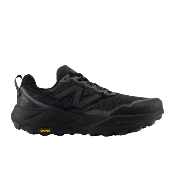 The NEW BALANCE Womens Fresh Foam X Hierro v9 Wide Black is a trail running shoe with a mesh upper, bold N logo, rugged sole, and Vibram® outsole for outstanding traction on any terrain.
