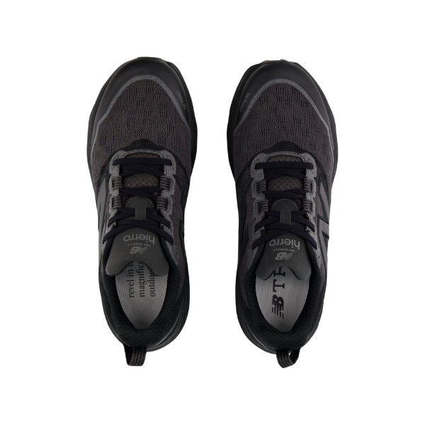A top-down view of the New Balance Womens Fresh Foam X Hierro v9 Wide Black trail runners, featuring dark mesh uppers, black accents, laces, branded insoles with text. Shoes are side by side on a white background.