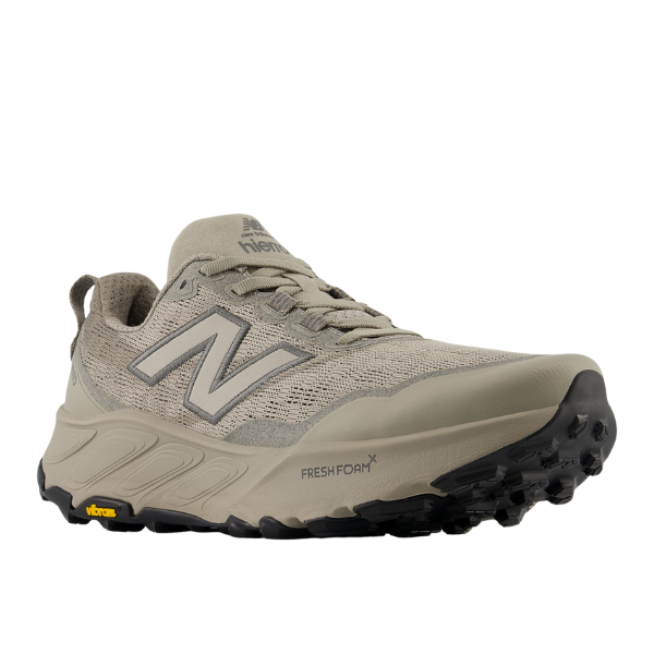 The New Balance Mens Fresh Foam X Hierro v9 Wide Grey features a mesh upper, large N logo, Vibram outsole, and Fresh Foam X branding on the midsole. The shoe is shown angled to display both the side and front.