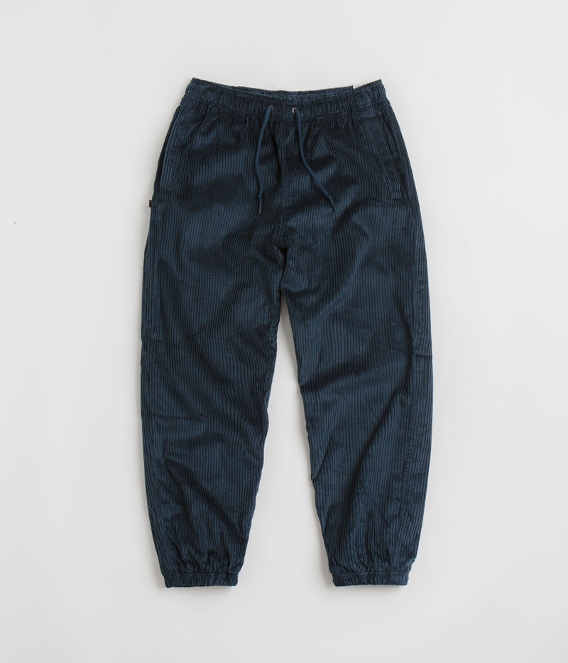 Nike SB Cord Pants in Armory Navy and Team Red