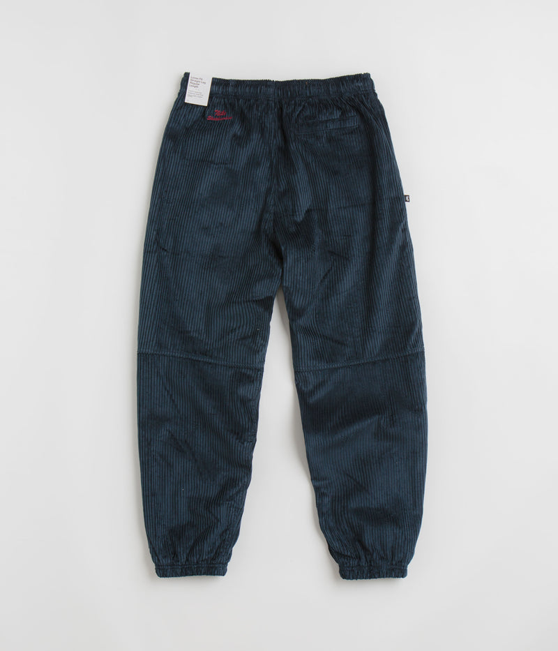 Nike SB Cord Pants in Armory Navy and Team Red