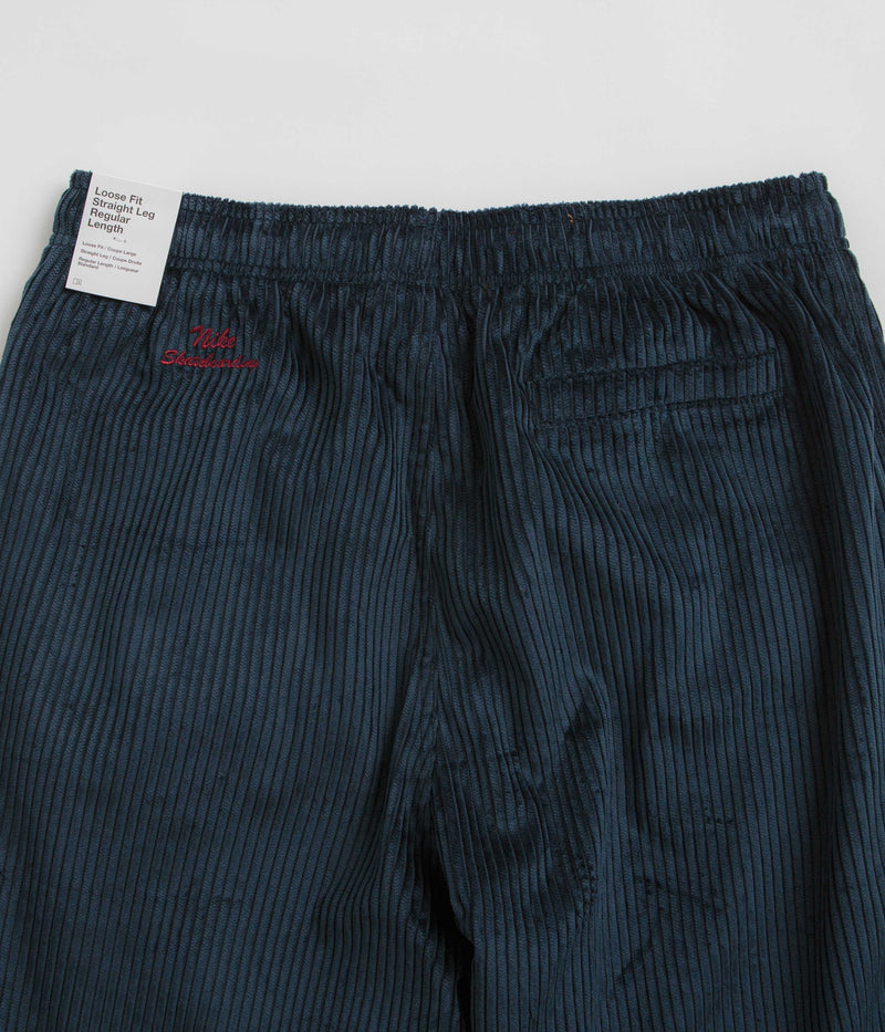 Nike SB Cord Pants in Armory Navy and Team Red