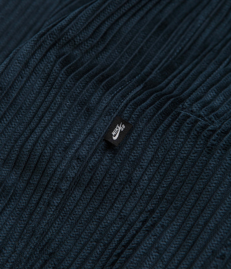 Nike SB Cord Pants in Armory Navy and Team Red