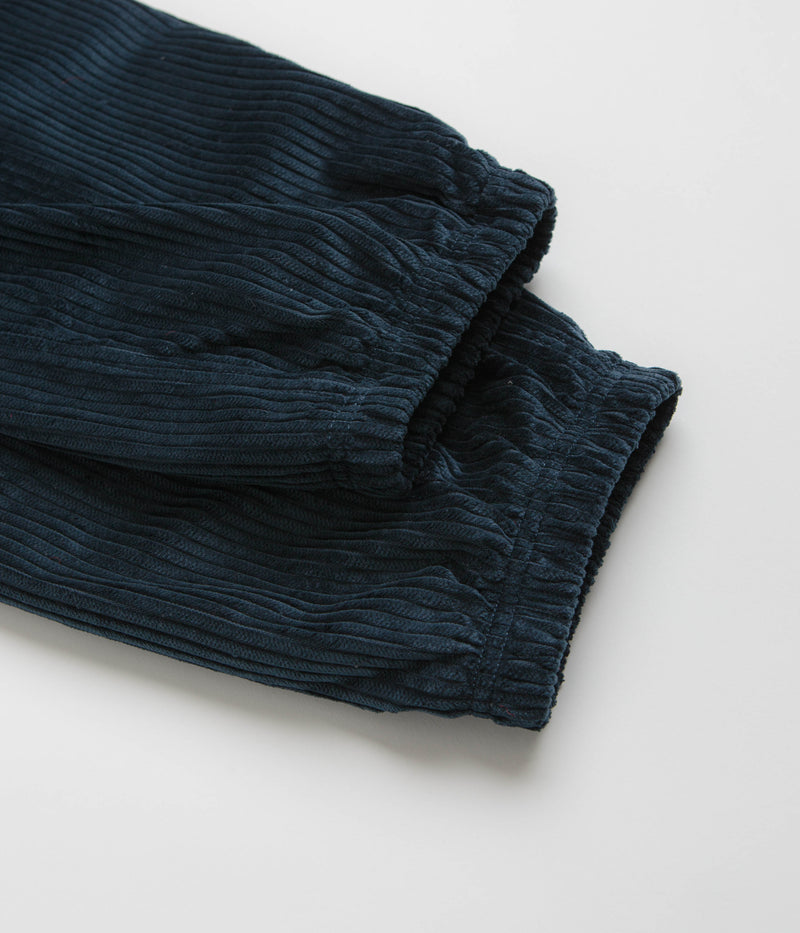 Nike SB Cord Pants in Armory Navy and Team Red