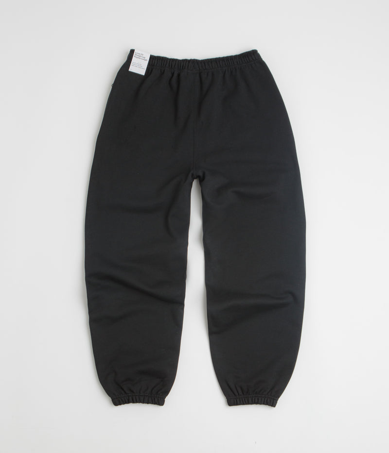 Nike Solo Swoosh Cuffed Sweatpants in Black and Black / White