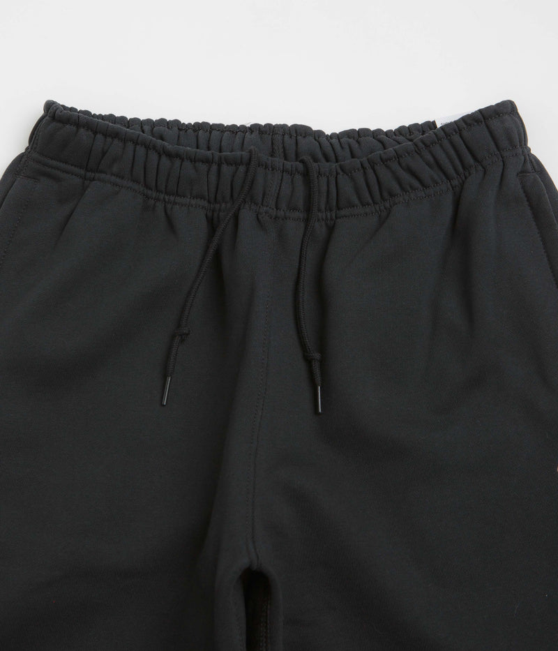 Nike Solo Swoosh Cuffed Sweatpants in Black and Black / White