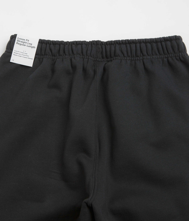 Nike Solo Swoosh Cuffed Sweatpants in Black and Black / White