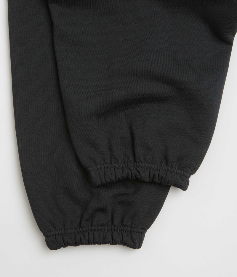 Nike Solo Swoosh Cuffed Sweatpants in Black and Black / White