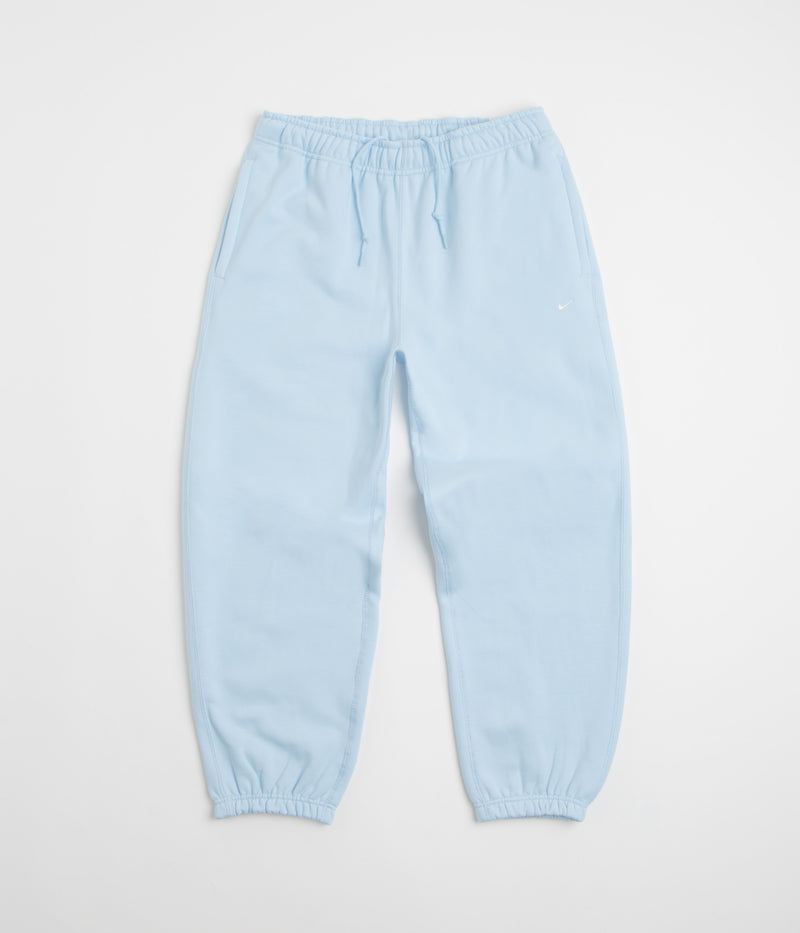Nike Solo Swoosh Cuffed Sweatpants in Celestine Blue and Celestine Blue / White