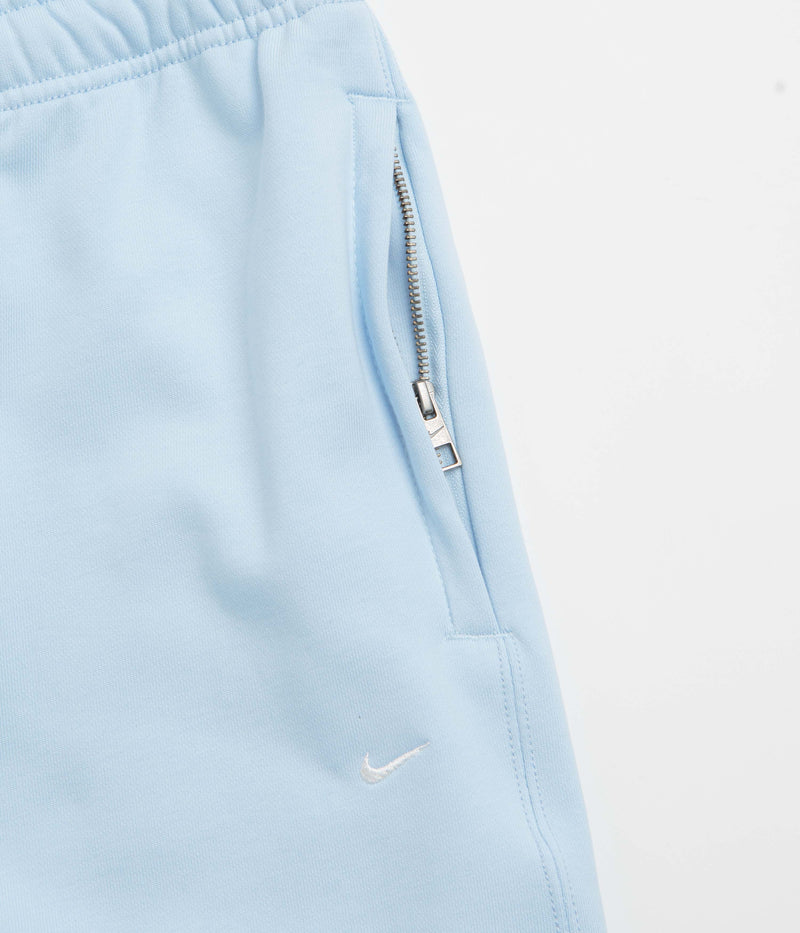 Nike Solo Swoosh Cuffed Sweatpants in Celestine Blue and Celestine Blue / White