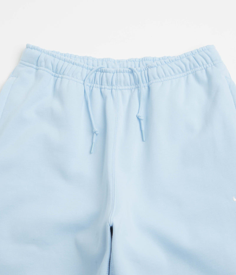 Nike Solo Swoosh Cuffed Sweatpants in Celestine Blue and Celestine Blue / White
