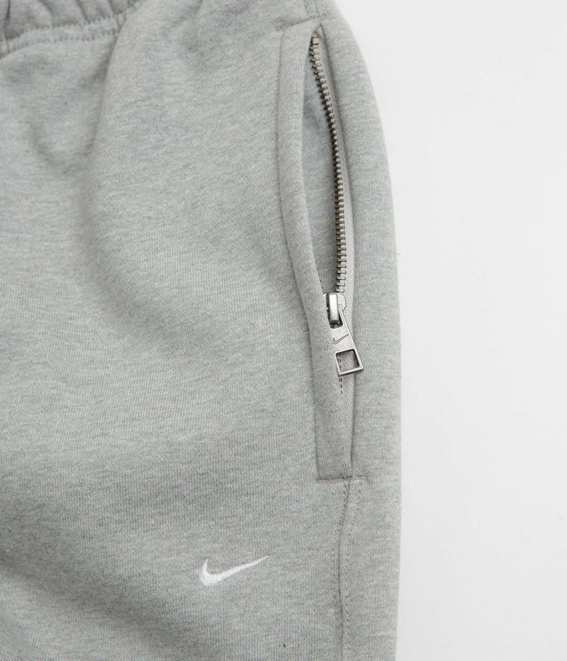 Nike Solo Swoosh Cuffed Sweatpants in Dark Grey Heather and Light Smoke Grey / White