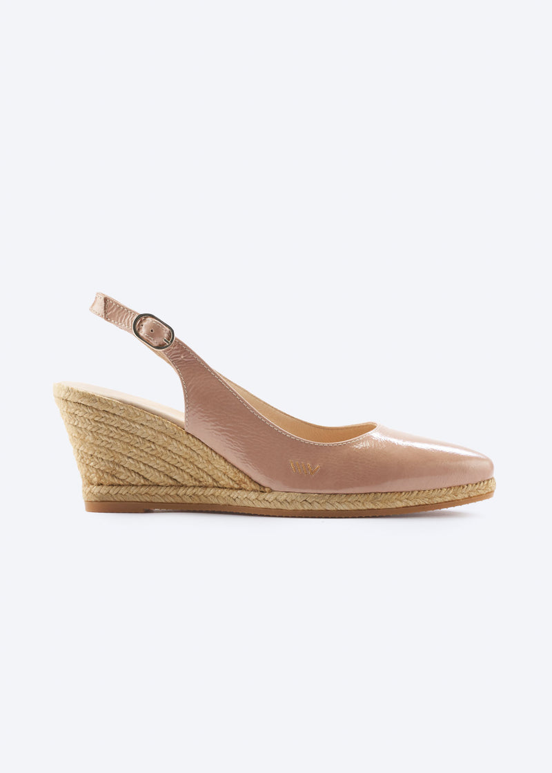 Side view of blush pink leather wedge espadrille sandal with slingback strap, pointed closed toe, and natural braided jute wedge, handcrafted in Spain