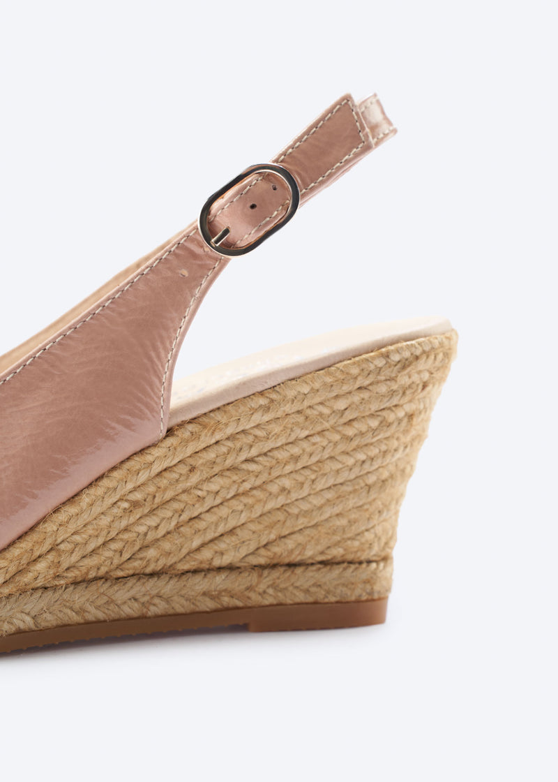 Close-up of blush pink leather slingback wedge espadrille with buckle detail and a natural braided jute wedge, handcrafted in Spain