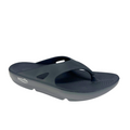 A dark grey SOVELLA Mens PF Thong sandal with a thick sole, enhanced arch support, textured footbed, Wide top strap, and visible brand logo on the side.