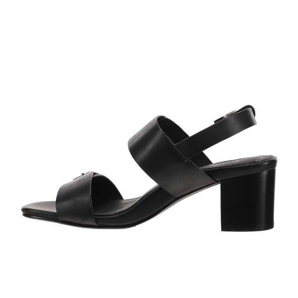The Sovella Womens Celeste Sandal Black by SOVELLA features two Wide black leather straps, a slingback with adjustable buckle, low block heel, and cushioned footbed. Shown on a white background.