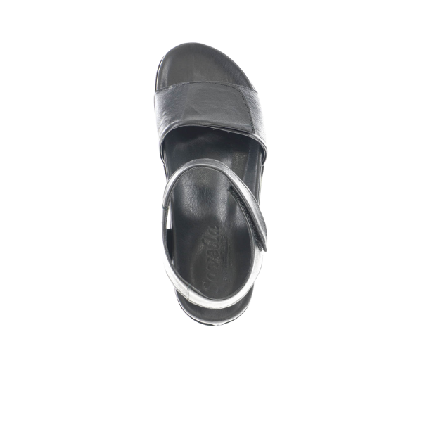 The Sovella Womens Chloe Black by SOVELLA features premium leather straps, a low heel, cushioned footbed, and ankle strap. Shown from above on a white background.