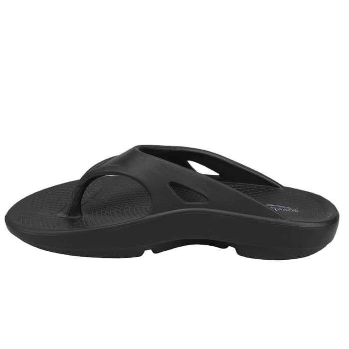 The Sovella Womens PF Thong Black is a womens comfort sandal from Sovella, featuring a contoured footbed, thick sole, and added arch support. Shown in black from the side against a white background.